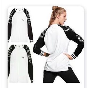 Pink Brand Shirt white with black sequin sleeves.